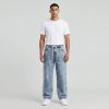 Male_model_wearing_blue_jeans_202606221006 Men’s Casual Drawstring Denim Joggers – Relaxed Fit